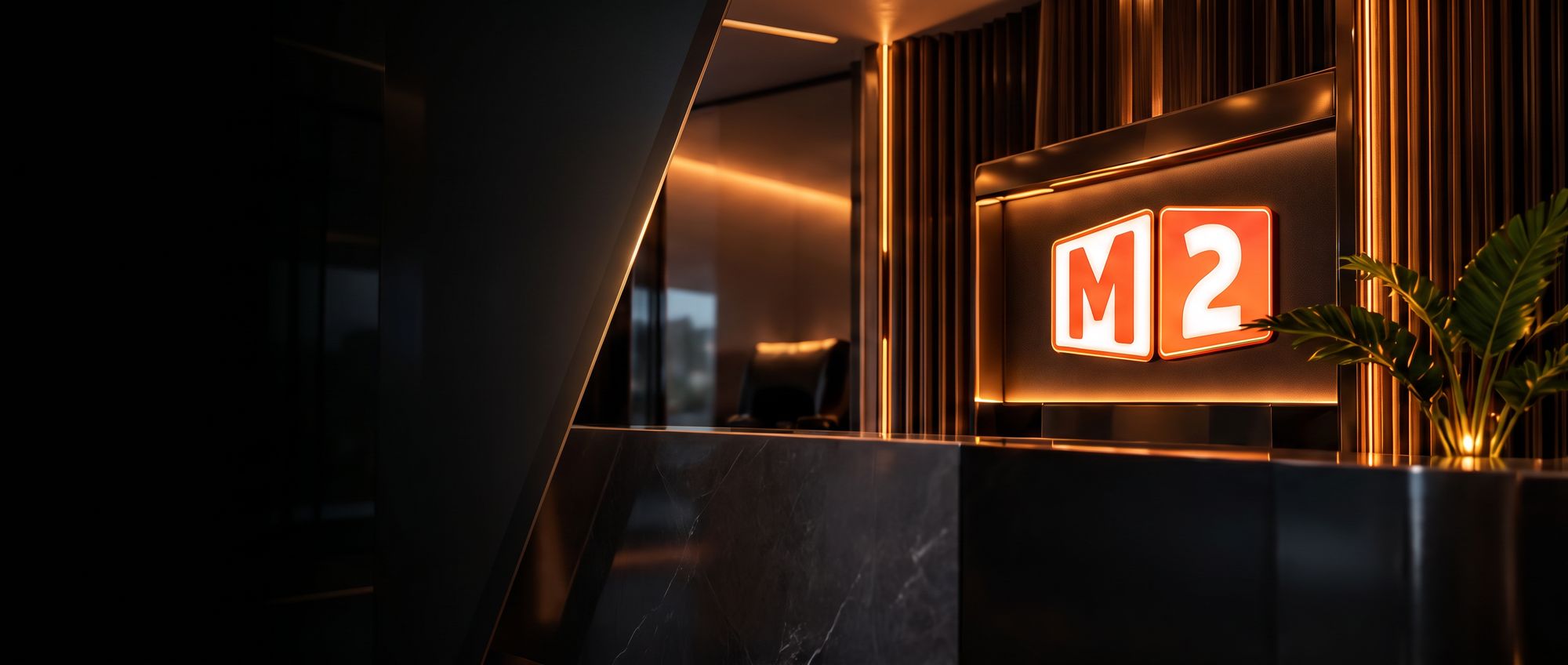 Kaunter penyambut tetamu pejabat M2 dengan logo M2 yang bercahaya
